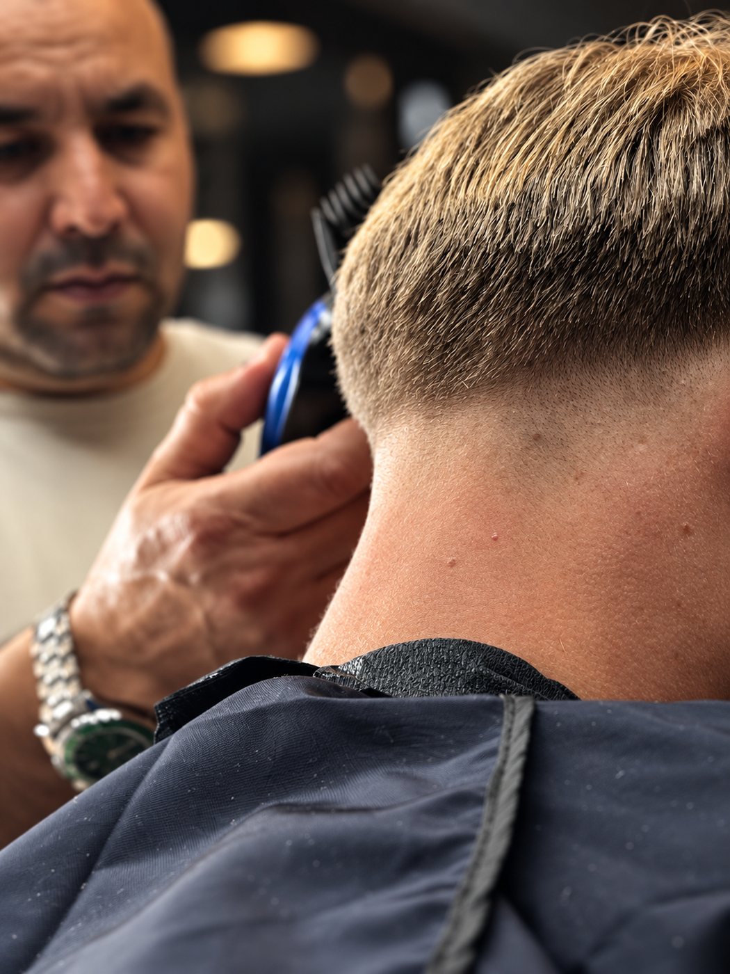 An Excellent Barber master at work, lining up a fresh cut