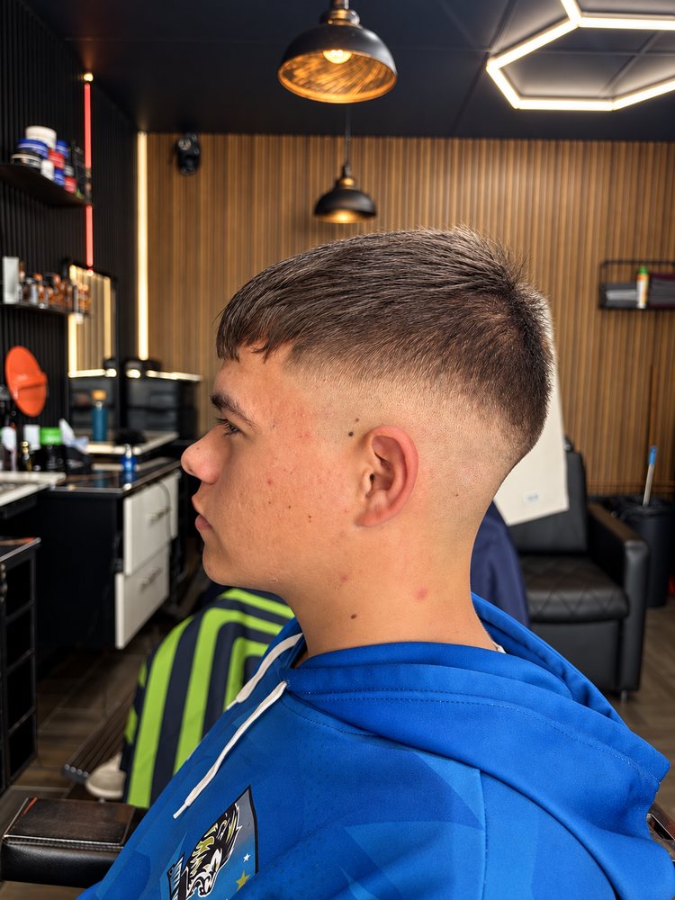 Brushed-up quiff with a tight taper